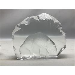 Two Mats Jonasson, Sweden paperweights, comprising polar bear in ice cave no 3152 and lion cubs, both with etched marks beneath, tallest H11.5cm