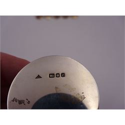 Set of six modern silver place card holders, each of circular form with pierced depictions of a partridge, spaniel, pheasant, stag, woodcock and duck, hallmarked J A Campbell, London 1985, contained within a velvet and silk lined fitted case, H3cm