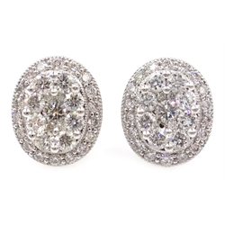  Pair of white gold oval set diamond cluster ear-rings, hallmarked 18ct  
