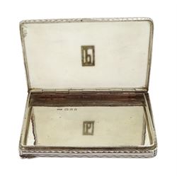 Art Deco silver and marcasite rectangular card case, the hinged cover inset with frosted moulded glass with applied silver marcasite letter 'P', London 1933, retailed by Asprey London and a silver and enamel compact, engine turned decoration with the 'The Essex Regiment'  emblem by John William Barrett, Birmingham 1941 (2)