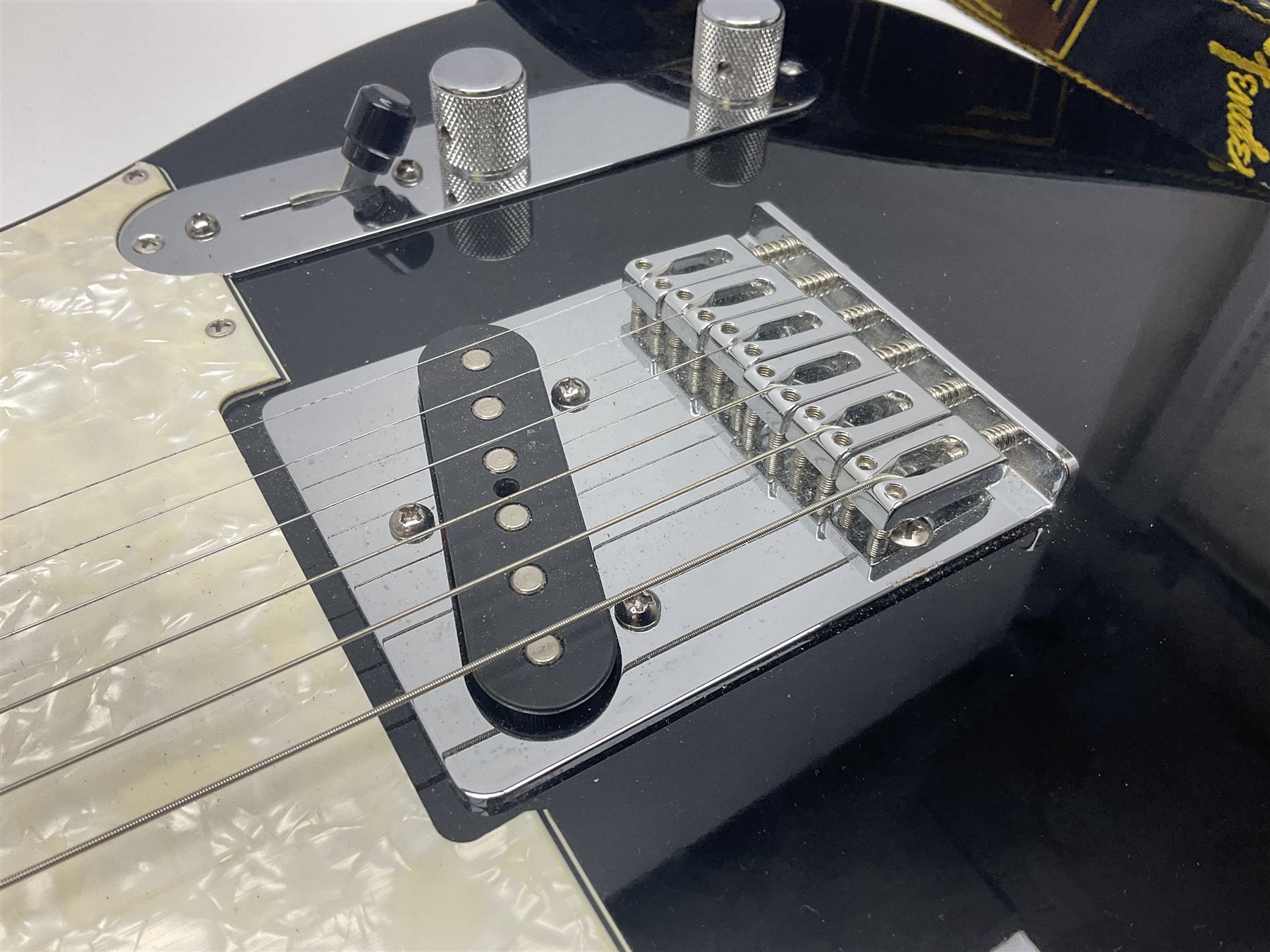2009 Fender Telecaster electric guitar in black, retro fitted with Charlie Christian copy pick-up, serial no.MZ9546274; L98cm; in Fender soft carrying case
