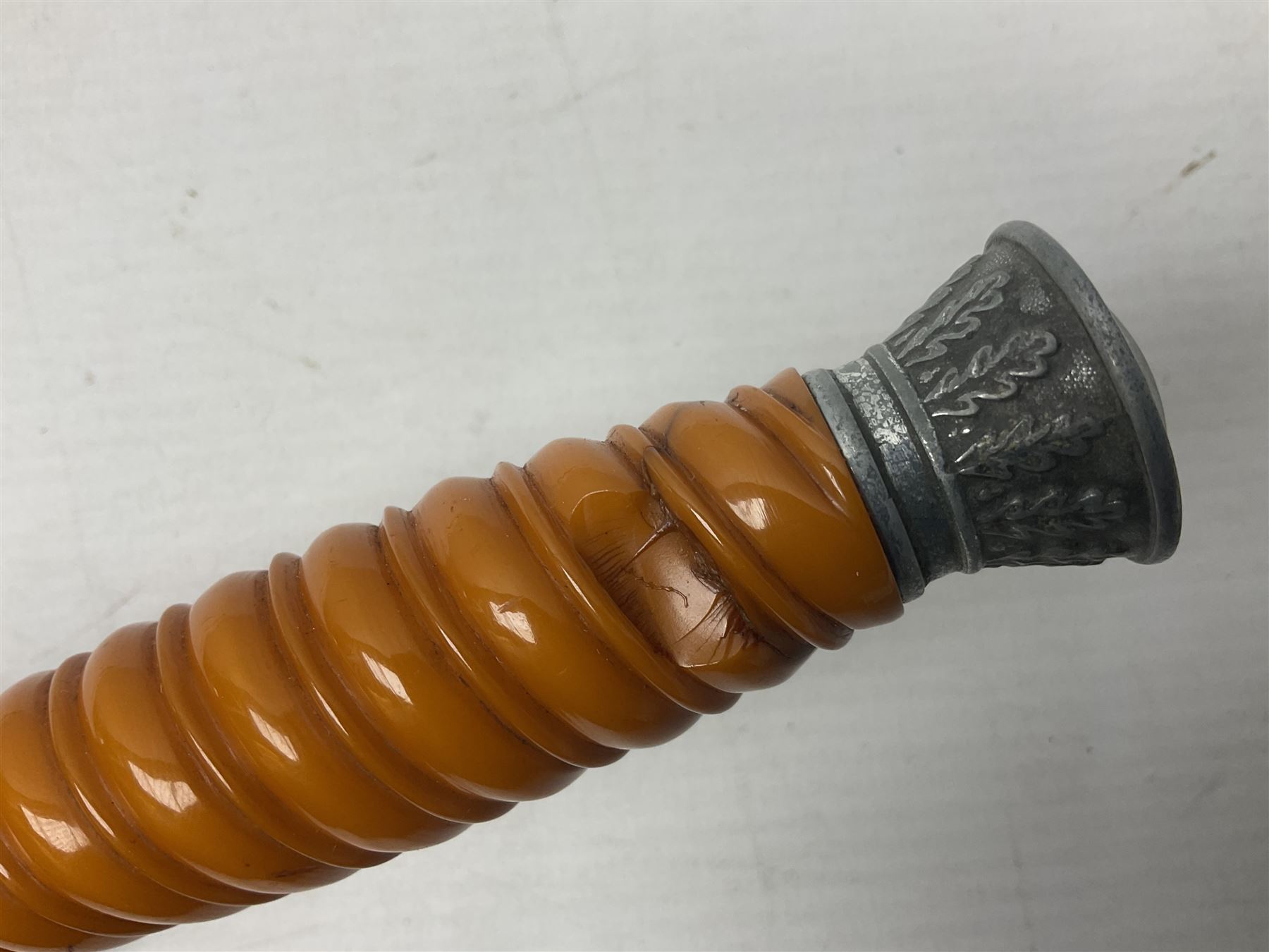 Late WW2 German Army Officers dress dagger, with unmarked 25cm double edged steel blade, orange celluloid grip, pommel and ferrule with oakleaves relief and cross guard with eagle; in original beaded scabbard with two hanging rings L39.5cm overall