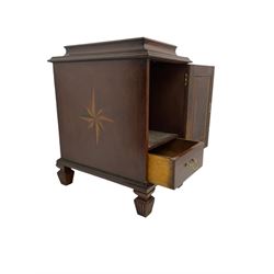 Regency style mahogany pedestal cabinet, sarcophagus top over single door enclosing drawer, the sides inlaid with star motifs, on square tapering lobe carved feet