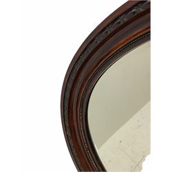 Early 20th century oval wall mirror, simulated rosewood frame, bevelled glass