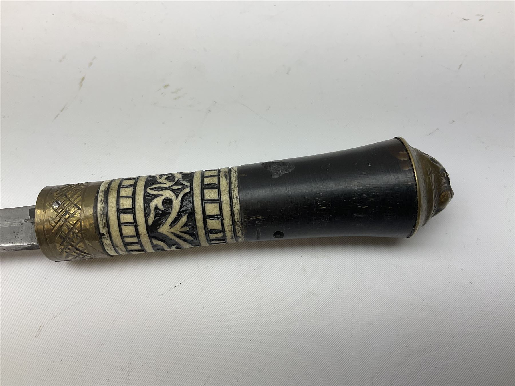 
Late 19th/early 20th century Anglo Indian ebony and bone sword stick with 62cm steel blade, brass locking ferrule and lion mask pommel L92 cm.