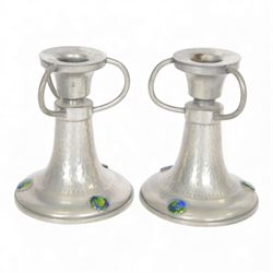 Pair of  Jugendstil hammered pewter candlestick each set with three blue and green enamel roundels, marked Germany beneath, H12cm