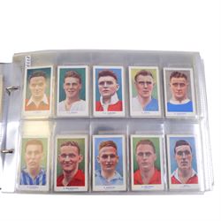 Collection of 1930s and later Football related trading and cigarette cards, including complete set of sixteen 1936 Topical Times Panel Portraits of Star Footballers, collection of further 1930s Footballer Panel Portraits, complete set of twenty-five 1955 The Wizard Famous Footballer cards, complete set of fifty Wills Association Footballers 1935, complete set of fifty Godfrey Phillips International Caps cards, etc, housed in three albums