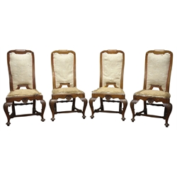  Set of four Queen Anne style walnut dining chairs, high back with shaped top rail, shell carved serpentine front rail and shell carved cabriole legs with pad feet joined by an H stretcher, (4)  
