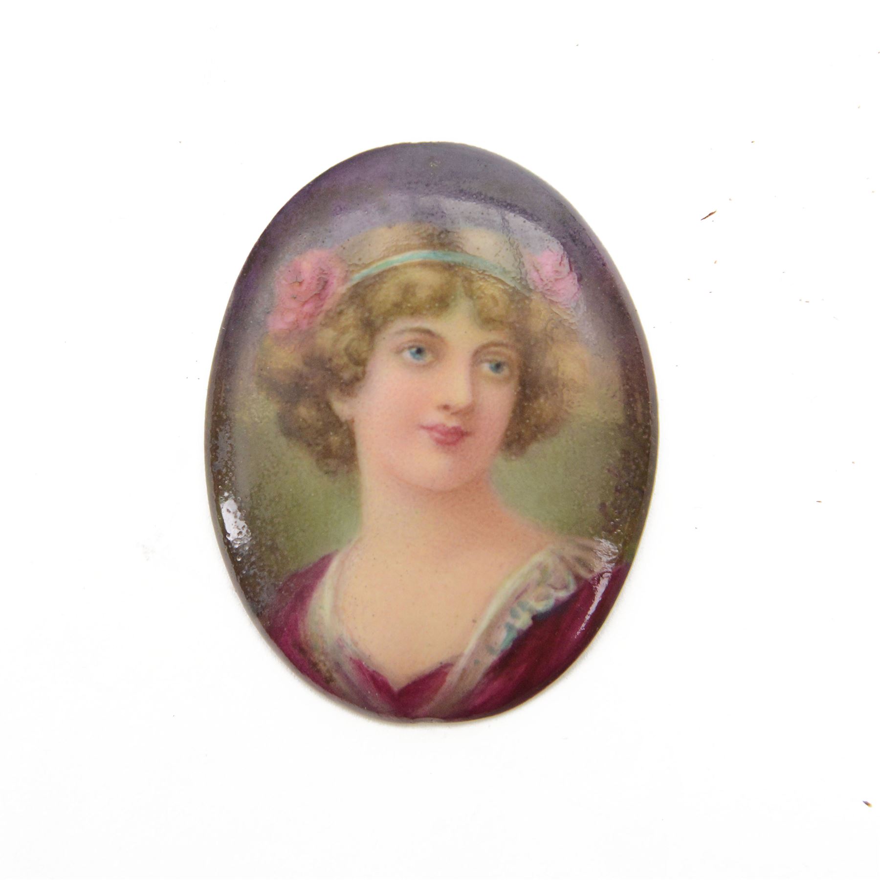 Royal Doulton porcelain plaque, hand painted with a portrait of a young woman, signed by Leslie Johnson, with printed backstamp verso, H5.5cm
