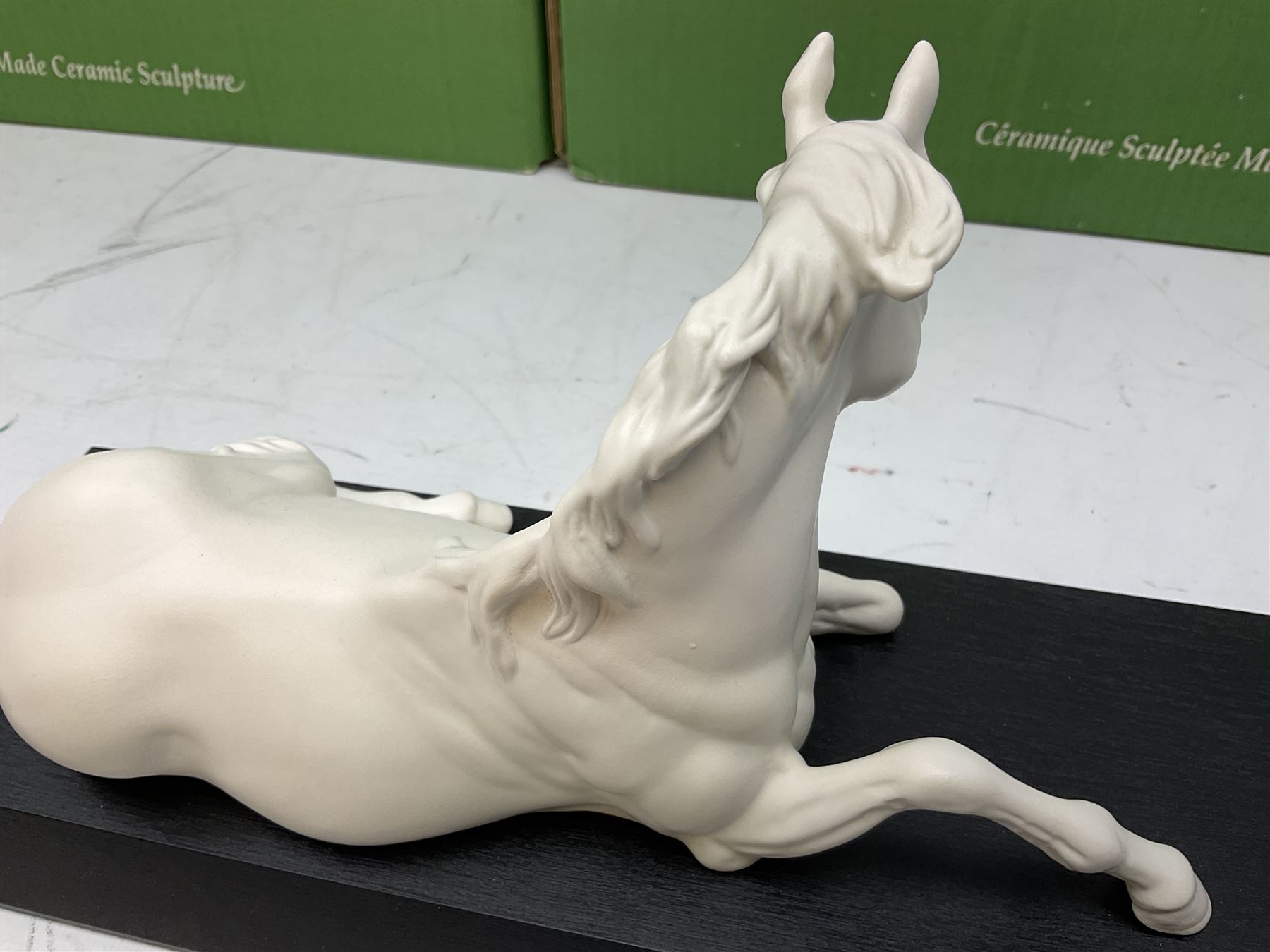 Five Beswick and Royal Doulton horse figures in matt white on black plinths, comprising of  Spirit of Affection no. 2689/2536, Springtime no.2837, Spirit of peace no.2916, Spirit of earth no.2914 and Spirit of the wild no. 183, together with a composite figure of a horse (6)