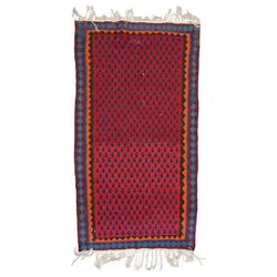 Group of four late 20th century wool kilim rugs, comprising a narrow tribal runner with stylised tree motifs and hooked guard bands (H 180cm, W 56cm), a lozenge medallion rug with decorative striped ends (H 125cm, W 75cm), a red and blue kilim with trefoil repeat field and multicoloured border bands (H 187cm, W 98cm), and a wide horizontal striped example with alternating lozenge and linear motif rows (H 260cm, W 173cm)