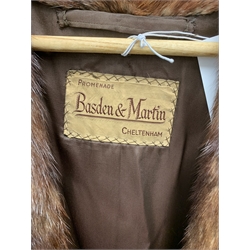 A lined Musquash fur coat. 