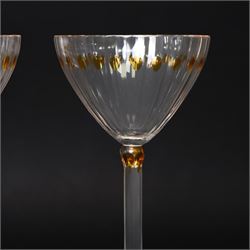 Otto Prutscher (1880-1949) - pair of early 20th century crystal wine glasses with citrine coloured ovals to the bowl and yellow stained at the top of the stem on a trumpet shape foot H21cm 
Notes: The glasses were probably made at the Meyr's Neffe glassworks, Adolf, Bohemia for the retailer E Bakalowits & Sohne, Vienna circa 1909