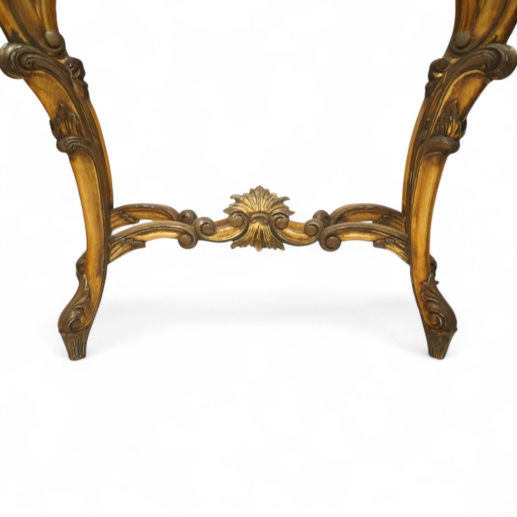 20th century Louis XV design giltwood console table, shaped white marble top over pierced and carved frieze with floral and foliate motifs, raised on cabriole supports united by X-shaped stretcher with central floral finial 