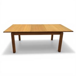 Contemporary teak dining suite comprising extending table and eight chairs, the table with rectangular plank top and one additional leaf extending to 210cm, supported on square tapering legs, the chairs with tall slatted backs and cream upholstered seats