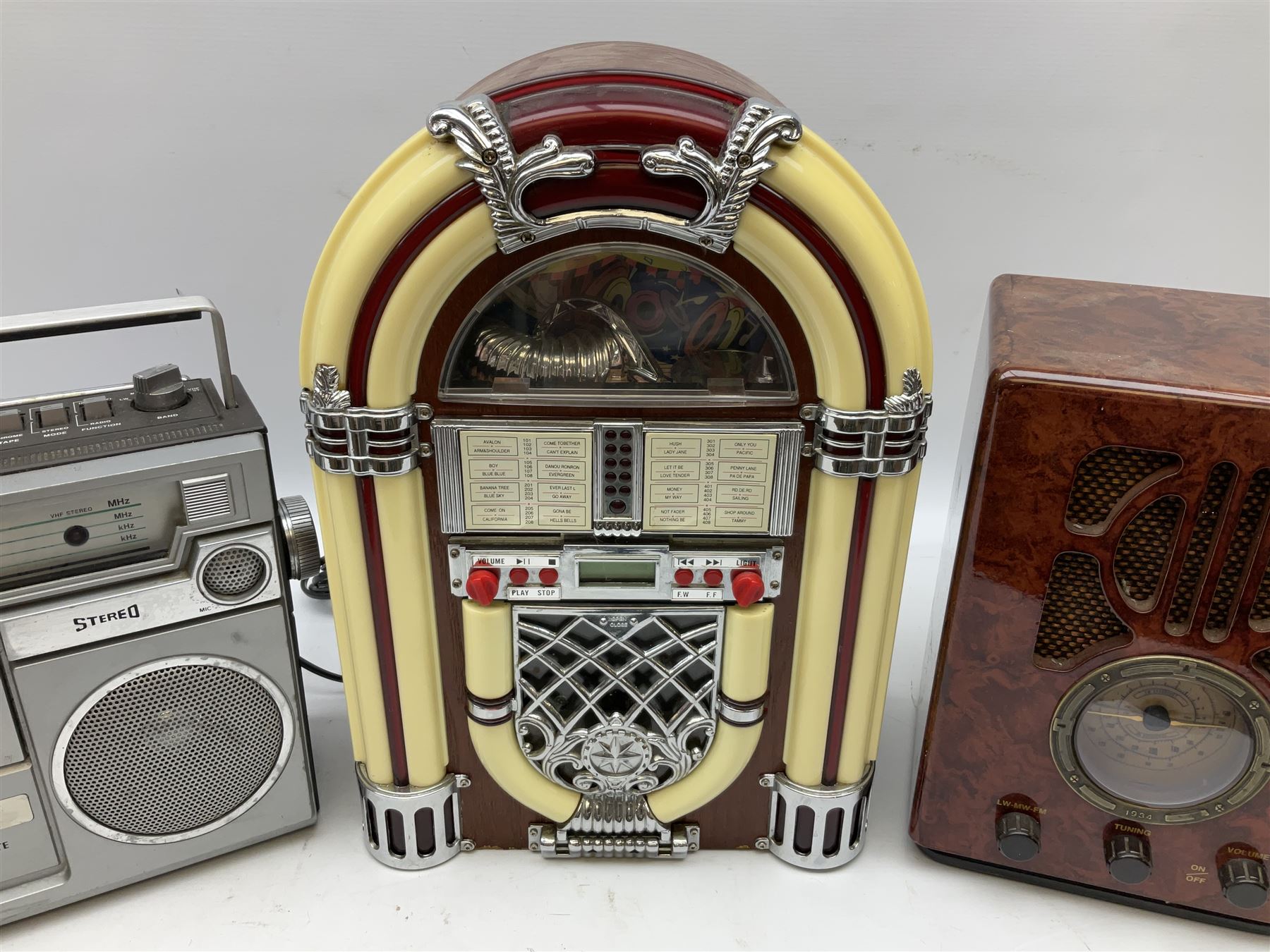 CD player in the form of a juke box, together with a Ferguson stereo and a vintage style radio