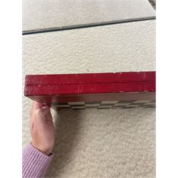 19th century walnut and brass bound games compendium box, painted to enhance the grain, of rectangular form, the hinged opening cover with rounded sides, central brass cartouche with engraved lion crest, and brass riveted straps, opening to reveal a red leather and blue silk lined compartmented interior, with fold-down games board, and lift-out tray containing playing cards, ebony turned dice towers, white and red stained bone draughts, and chess pieces, ivory dice, and ivory and ebony whist markers, and brass bezique board, cribbage board and markers, H15cm W32cm D24cm
This lot has been registered for sale under Section 10 of the APHA Ivory Act