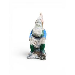 Early large scale composite stone garden gnome, original distressed paint