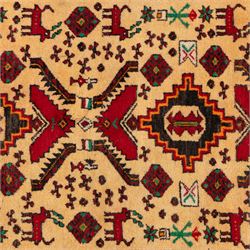 North East Persian Meshed Baluch rug, the ivory field decorated with two stepped diamond medallions and angular red motifs, interspersed with stylised horned animals, birds, flowerheads and geometric devices, enclosed by a dark brown border of repeating red serrated leaves and narrow ivory guard bands