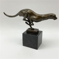 Stylised bronze figure of a running cheetah, with foundry mark, raised upon a marble base, H19cm overall