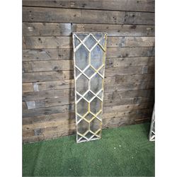 Four 19th century cast iron windows, lattice glazed in white painted finish, 