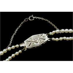 Double strand graduating pearl necklace, on 9ct white gold diamond clasp