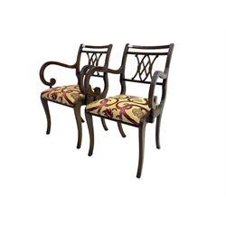 Regency design mahogany twin pedestal dining table, rectangular top with reeded edge, acanthus carved turned column terminating in reeded tripod base with hairy paw feet and castors (W172cm D92cm H75cm) and set eight (6+2) Regency design mahogany dining chairs, pierced back with scroll design, seat upholstered in patterned laurel green fabric, raised on reeded sabre supports (W48cm H88cm)