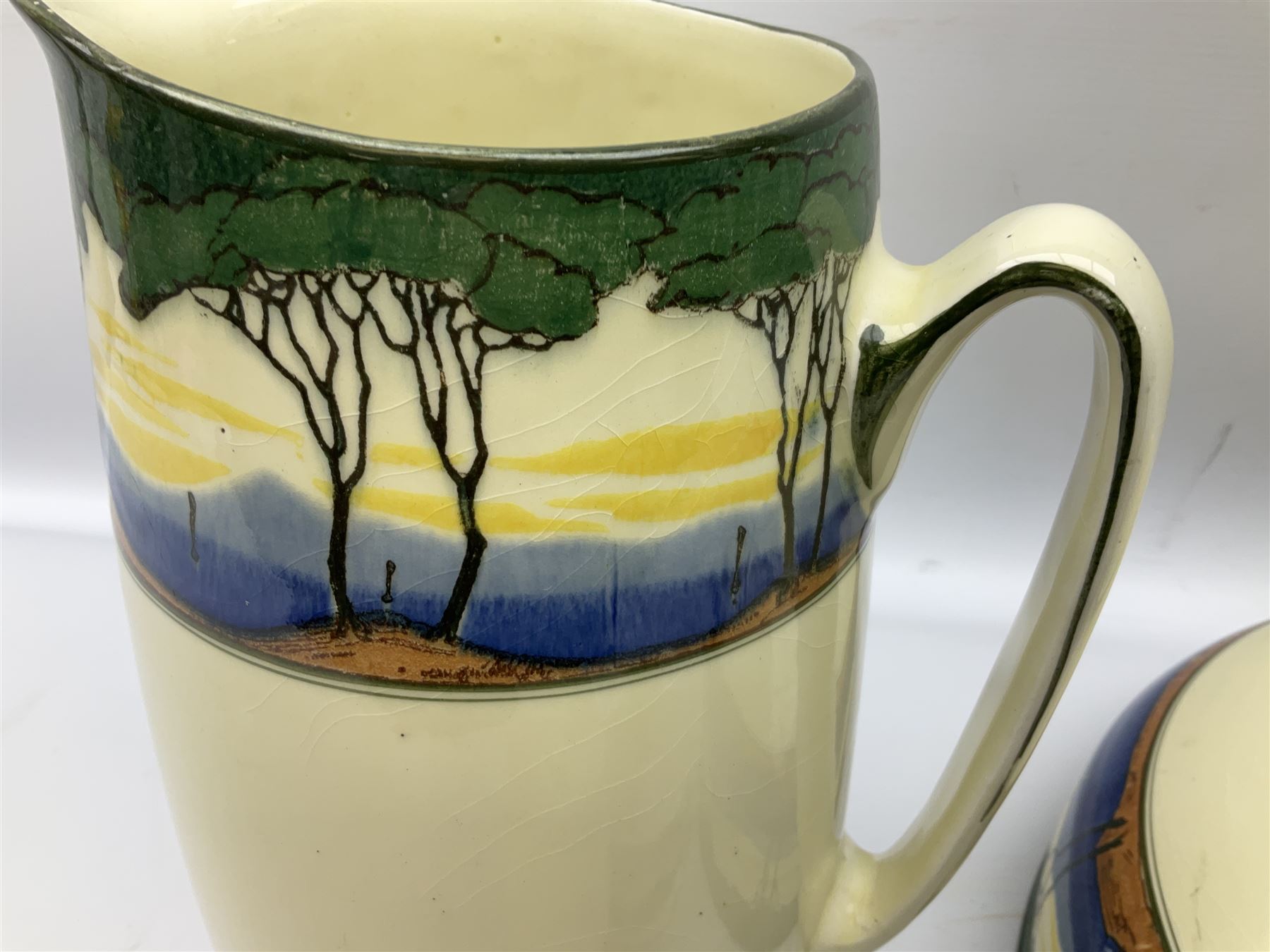 1930's Art Deco Royal Doulton ceramics decorated with stylised trees, comprising washbowl and jug, soap dish and vase