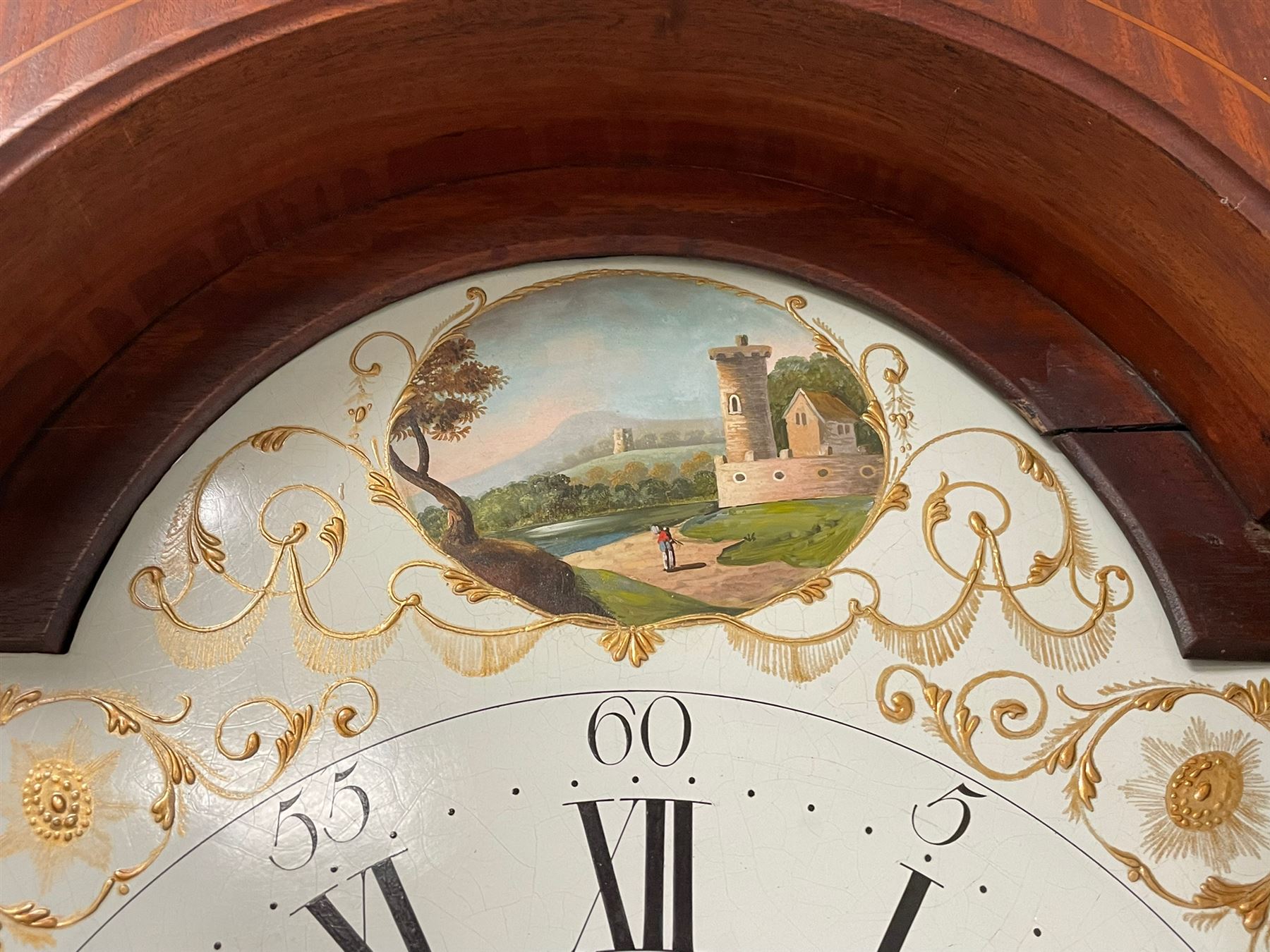 Thomas Greaves of Newcastle - late 18th century 8-day mahogany longcase clock c1790, with a flat topped hood and break arch hood door flanked by pilasters with Corinthian capitals, trunk with canted corners and ogee spire topped trunk door, rectangular plinth on a decorative stepped base,  early painted dial with raised gesso spandrels and a painted oval landscape to the arch, with matching steel hands, Roman numerals, five minute Arabic's and minute markers, subsidiary seconds dial and calendar aperture,  dial pinned via a cast falseplate to a rack striking movement with a recoil anchor escapement, striking the hours on a bell. With pendulum and weights.