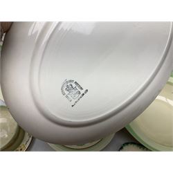 Clarice Cliff for Newport Pottery Corolla pattern tea and dinner wares, comprising triangular bowl, four side plates, two shallow bowls and teacup (a/f), together with a Clarice Cliff Wilkinson twin handled soup bowl and unassociated saucer both decorated with pink and yellow flowers, together with other mid century ceramics comprising Parrott and Company Coronet Ware, and Royal Staffordshire AJ. Wilkinson Ltd dinner wares