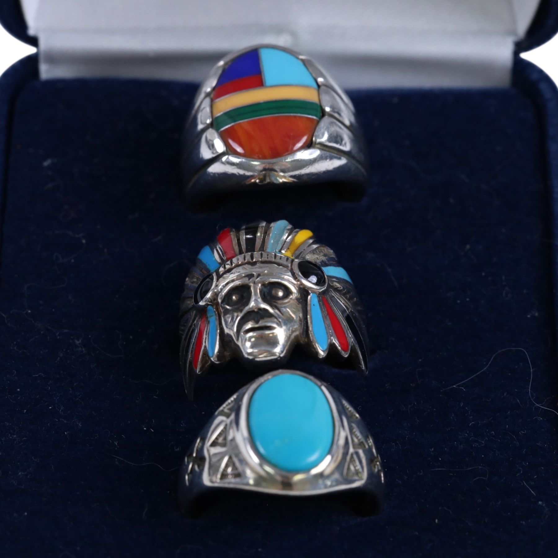 Silver-gilt stone set suite of jewellery, including ring, necklace and pair of earrings, together with five stone set/enamel rings and a coin ring