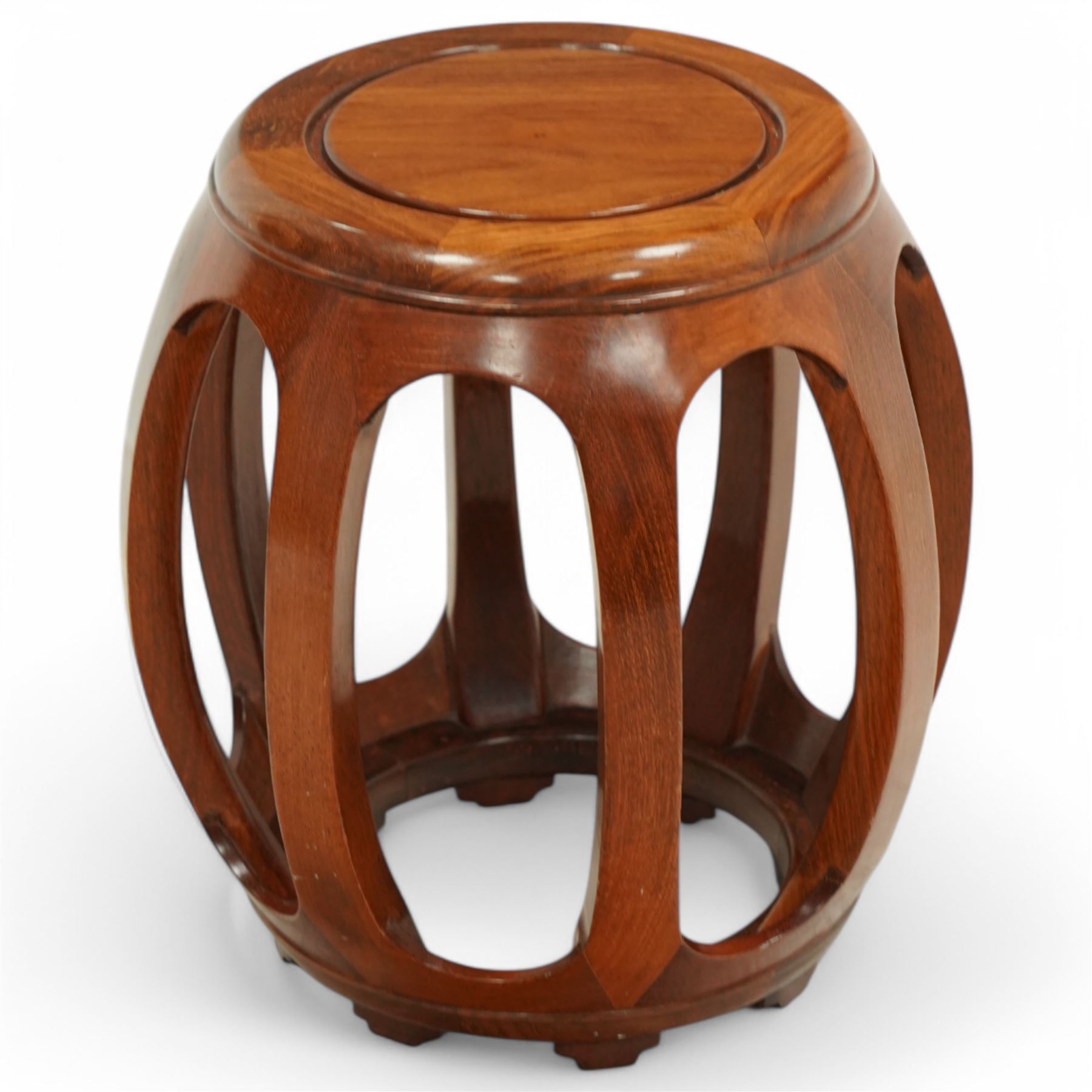 20th century Chinese hardwood drum-shaped stool or side table, circular top above shaped apron raised on eight curved scroll-decorated supports