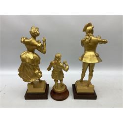 After J. Lavergne, pair of gilt painted spelter figures of a Dandy and his lady, each titled 'Propos Galant' on wooden base H41cm; and another gilt painted spelter figure, possibly Samuel Pepys (3)