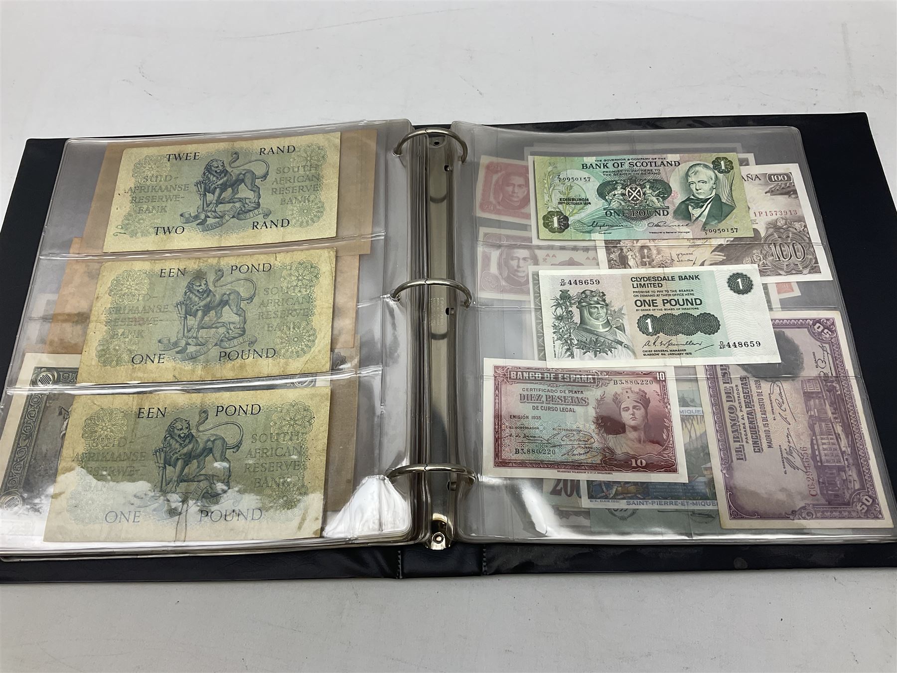World banknotes, including Queen Elizabeth II The States of Jersey one pound 'DB202703', five pounds 'BB527762' and ten pounds 'AB651481', reserve bank of New Zealand two dollars '1L3 741894', King George V Straits Settlements one dollar 1st January 1935 'F/83 28924', various Bank of England notes etc, housed in two ring binder albums