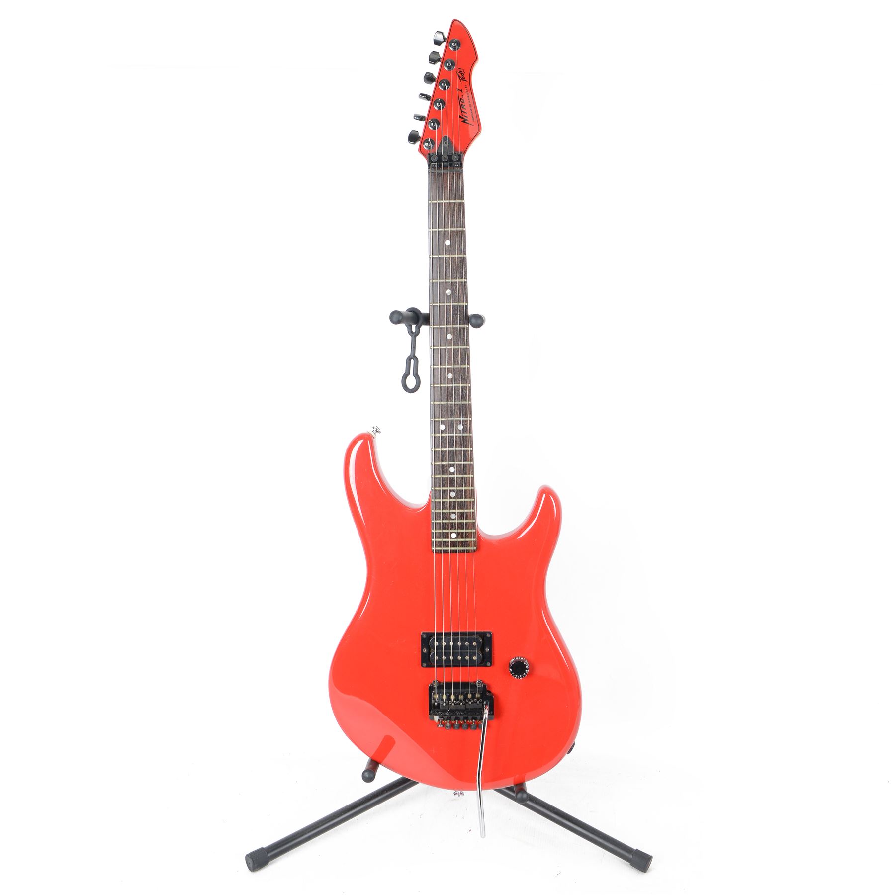 1980s American Peavey Nitro I hand-made electric guitar with Kahler tremolo, in bright red finish, serial no. 02786479, L97cm, in Gear4Music soft carry case