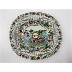 Pair of 19th century Chinese Canton Famille Rose Armorial platters, each enamelled with flowers and figures in garden and boat scenes within a pierced gallery, with central roundel painted with the Arms of Clerke (or Claerk) surrounded by a gilt ribbon reading the motto ‘Munus et Monumentum Victoriae Henry VIII spurs 1513’ (‘In remembrance of the victory of King Henry VIII at the Battle of Spurs in 1513’). Most likely made to commemorate the 300th anniversary of the battle for a descendant of Sir John Clerke of Weston, who took prisoner in 1513 the Duke de Longueville, L28cm