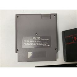 Nintendo Entertainment System (1985) console with two controllers, accessories and instruction booklet. NES Games ‘Duck Hunt’ with Nintendo Zapper gun, ‘Pinball’ and ‘Super Mario Bros.’, all with original sleeves and instruction booklets. NES game ‘Super Mario Bros. 2’ cartridge only