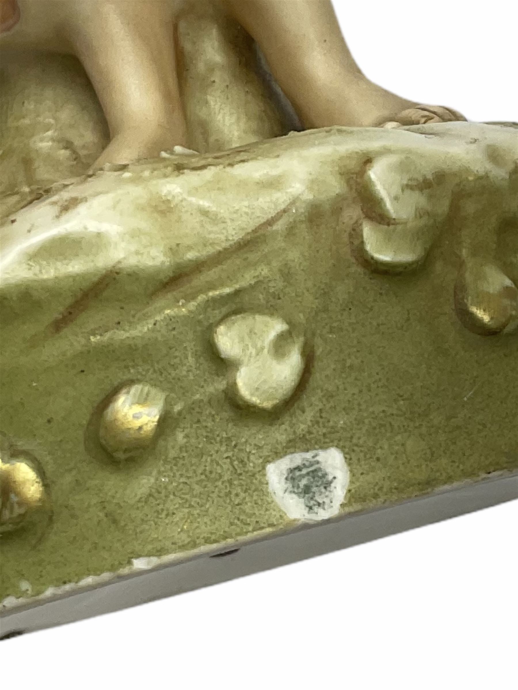 Royal Dux figure modelled as a fish seller, with applied triangle mark to the base and impressed model number 2292, H27cm, together with three Royal Dux style elephants, and a pair of Austrian Turn Wien figures, each carrying 'striker' baskets for matches. 