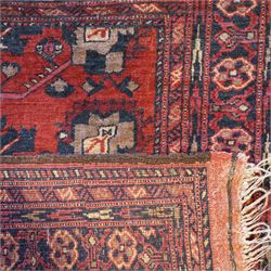 Afghan red ground rug, the field decorated with stylised plant motifs, within multiple borders (137cm x 105cm); together with a Caucasian red ground rug decorated with three Gul motifs (123cm x 85cm)
