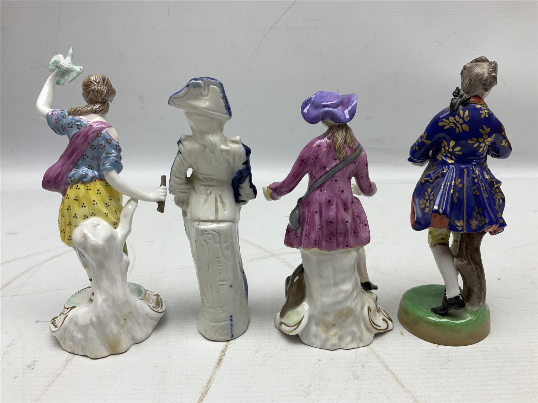 Seven Spode Chelsea figures, comprising no.1, no.2, no.3, no.4, no.6 and two further smaller examples, together with a Dresden figure of a gentleman, no. K10003, and a Delft style figure of a boy, some with boxes, tallest H23cm (9)