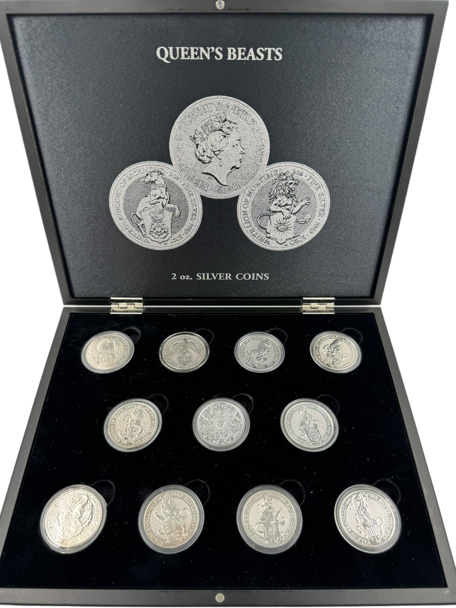 Eleven Queen Elizabeth II 'Queen's Beasts' two ounce fine silver coins, including 2016 'Lion of England', 2017 'Griffin of Edward', 2018 'Black Bull of Clarence' etc, housed in a display case