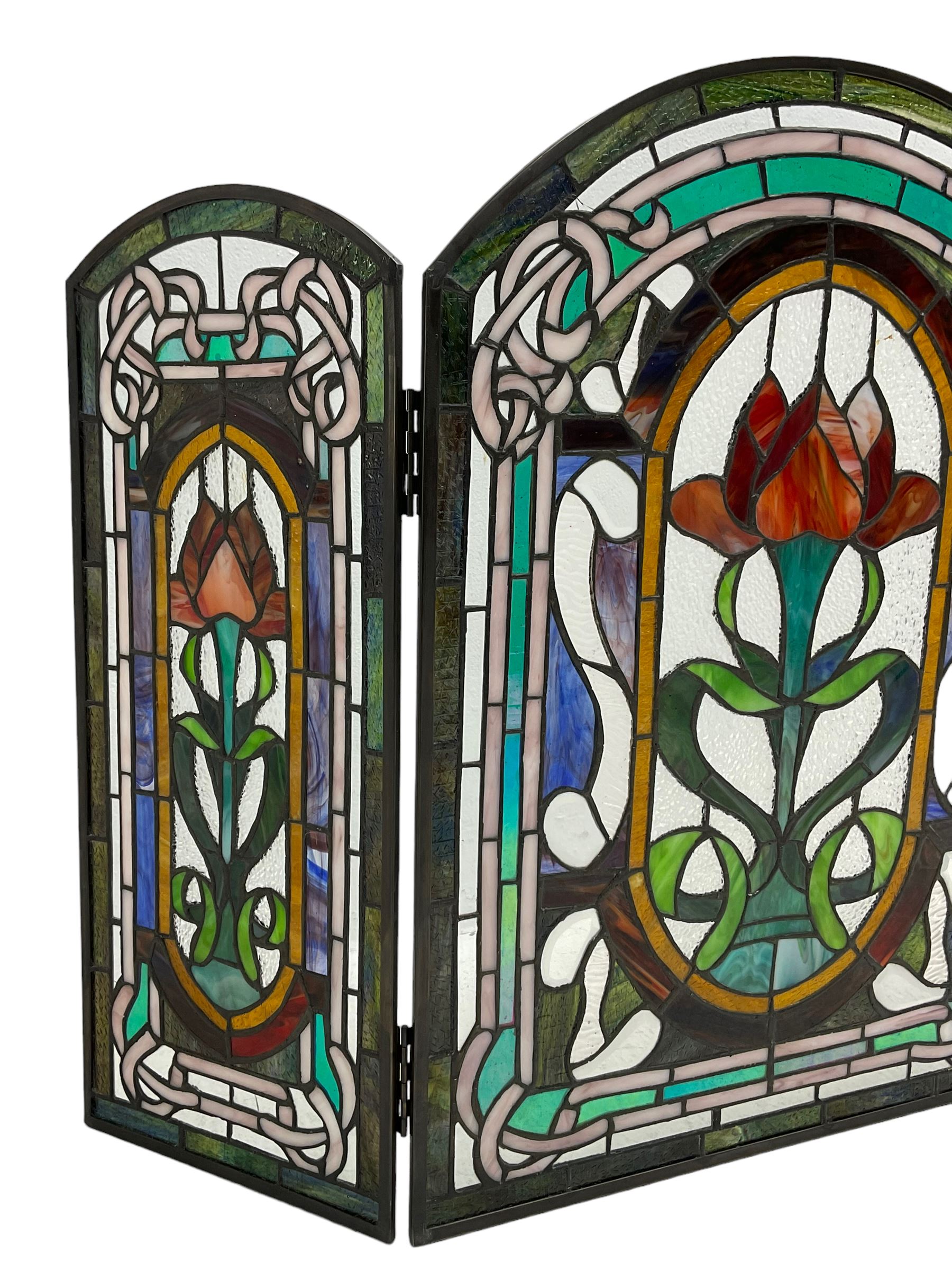 Art Nouveau design stained glass three panel fire screen, decorated with tulips and interlacing borders