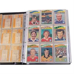 Collection of Football related trading cards, stickers and coins, including 1990 Esso World Cup Coin Collection, an empty 2010 Esso Official England Medal Collection Folder, incomplete 1990 Italy World Cup Commemorative Medal Collection, 1998 The Official England Squad Medal Collection, 1970s Topps All Stars Cards, 1992 Panini Official Football Players cards, Euro 2008 Collectors Binder and Cards, Panini 2009/10 Champions League Stickers, etc housed in four folders