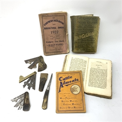 Three veterinary or agricultural fleams, two brass cased and one horn cased, together with a hoof knife, and four agricultural texts, to include The Gradeners and Poultry Keepers Guide and Illustrated Catalogue of Goods Manufactured and Supplied by W Cooper Ltd, The Farmer's Red Book and Agricultural Annual 1922, and How to treat Cattle ailments. 