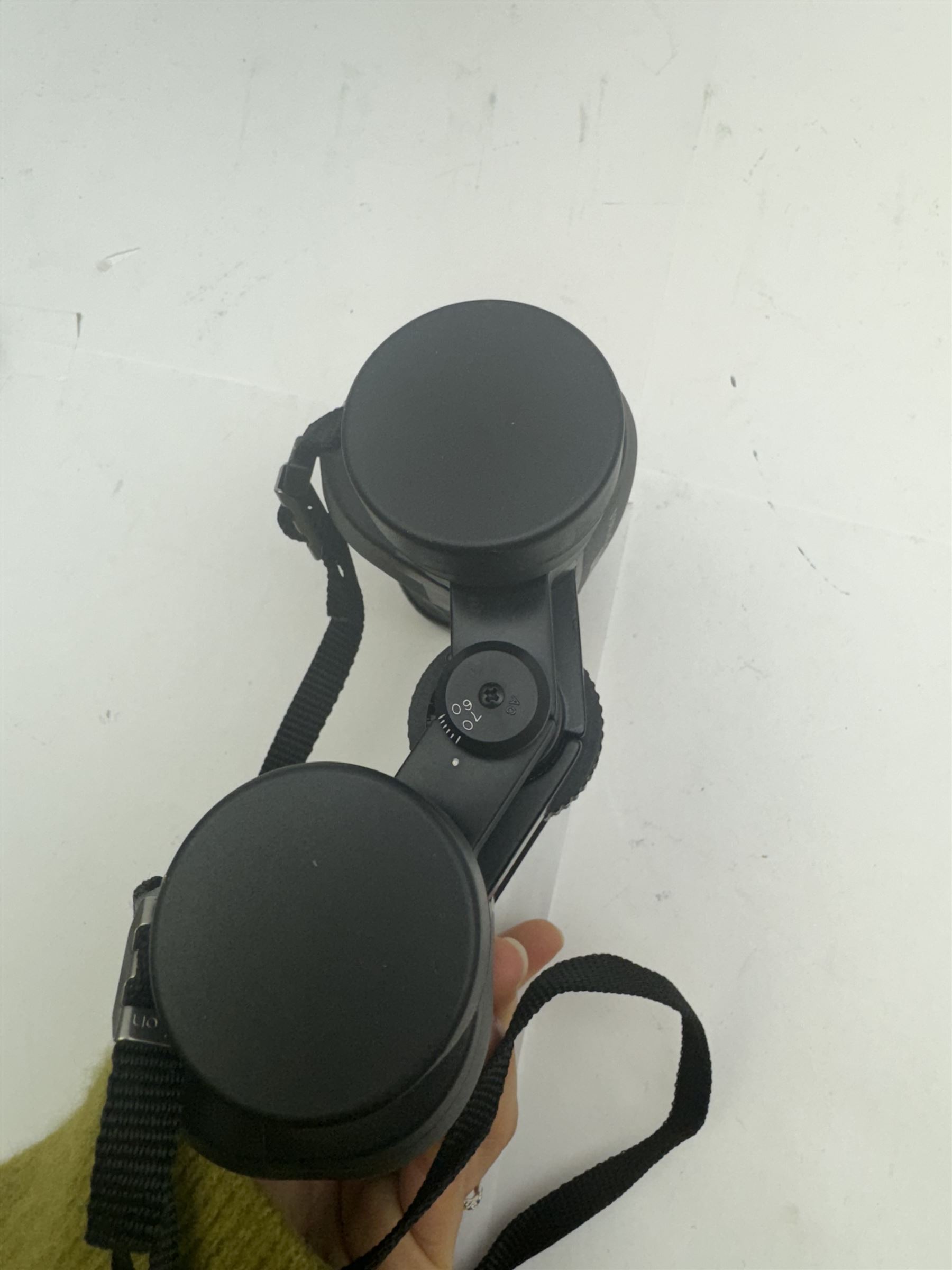 Four pairs of binoculars, to include Carl Zeiss Jena Jenoptem 8x30W serial no. 3750814, Nikon Sporting II 8x40 serial no. 604672, Minolta Pocket II 8x22 Field 7 and Jessops 12x25 Field 4.8 84m/1000m, all in carrying cases 