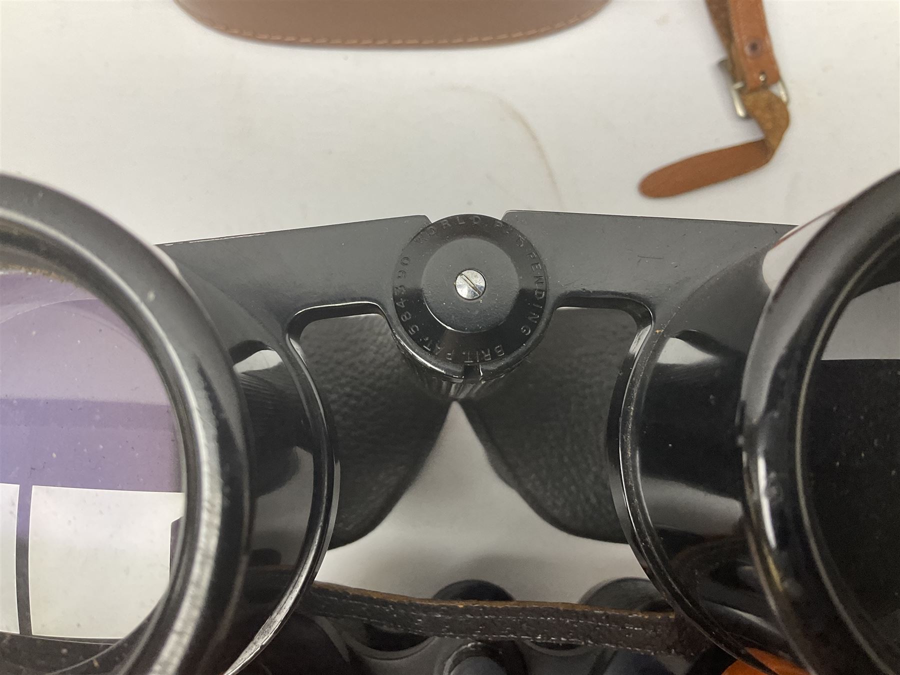 Ten cased pairs of binoculars, to include Ross London Steplux 7x50, Ross Solaross 16x60, Crescent zoom 7x- 12x50, Hilkinson 20x60,  Ross Stepnada 7x30,  Philo 10x50 etc