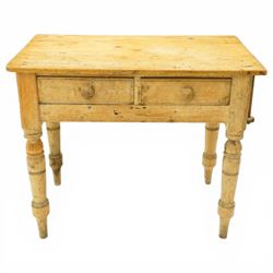 Victorian stripped pine table fitted with two drawers, supported on turned supports