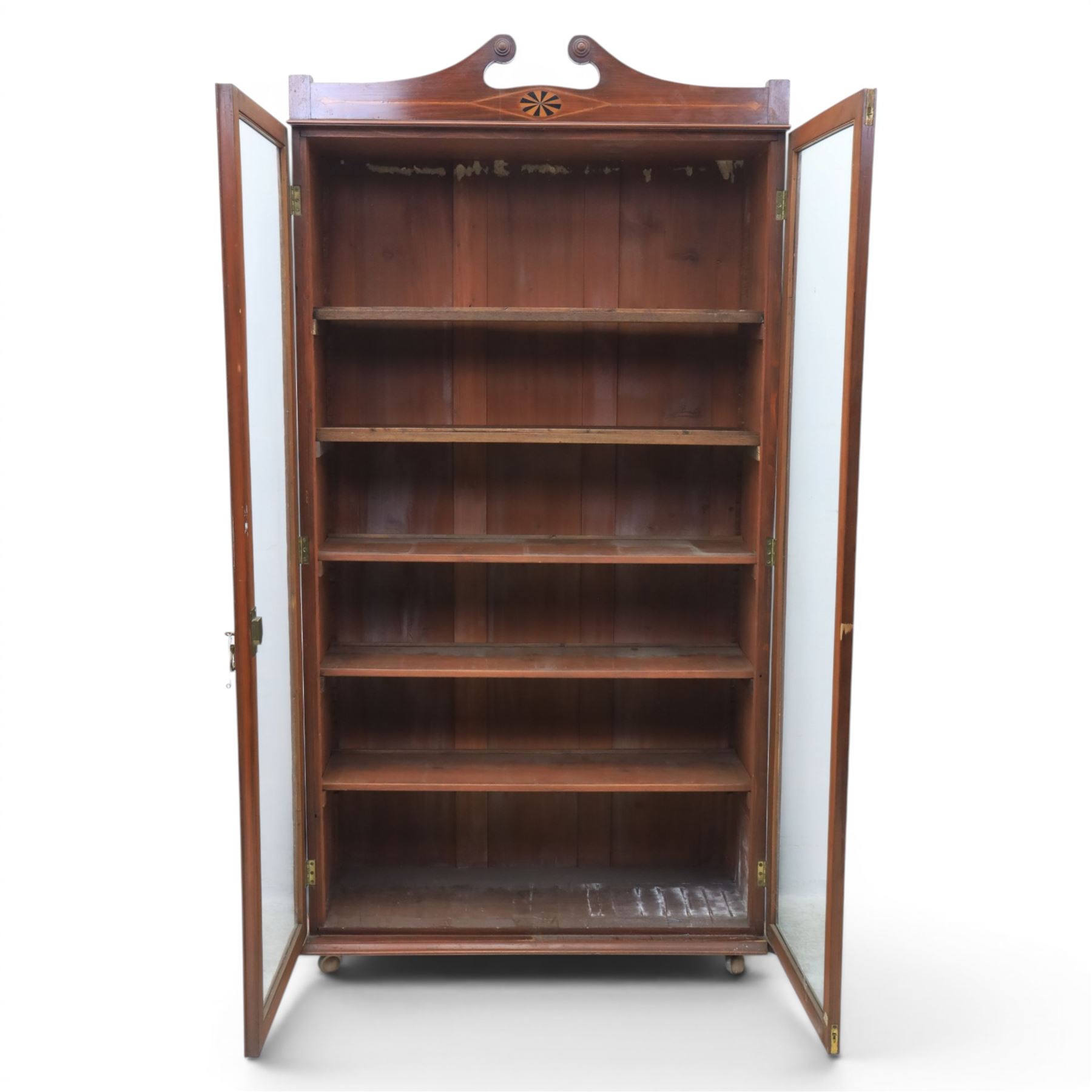 Edwardian walnut bookcase, fitted with two full height glazed doors, inlaid detail with checkered motif, adjustable shelves
