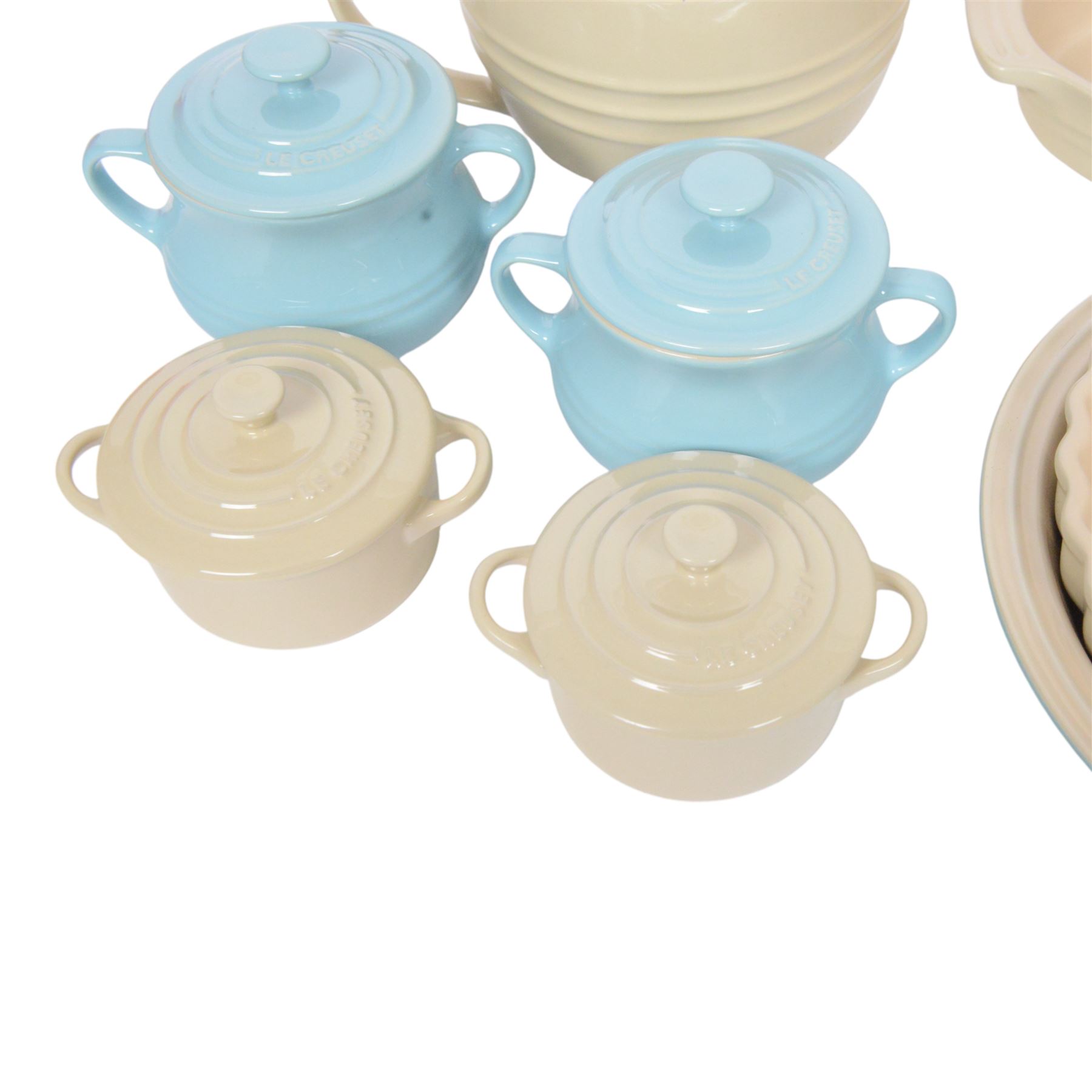 Le Creuset ceramic kitchen wares in cream and light blue, including pie dishes, baking dishes, petit casseroles etc  