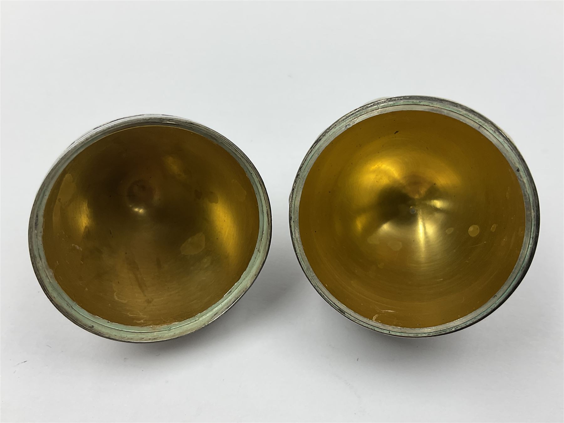 Modern silver limited edition Easter egg, no. 70/500, the gilded body decorated in relief with silver latticework and a band of flower heads, the detachable cover opening to reveal a gilt interior, each hallmarked St James House Company, London 1978, H5.5cm